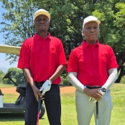 ESR Golf Day 2024 — Golfers beside their cart