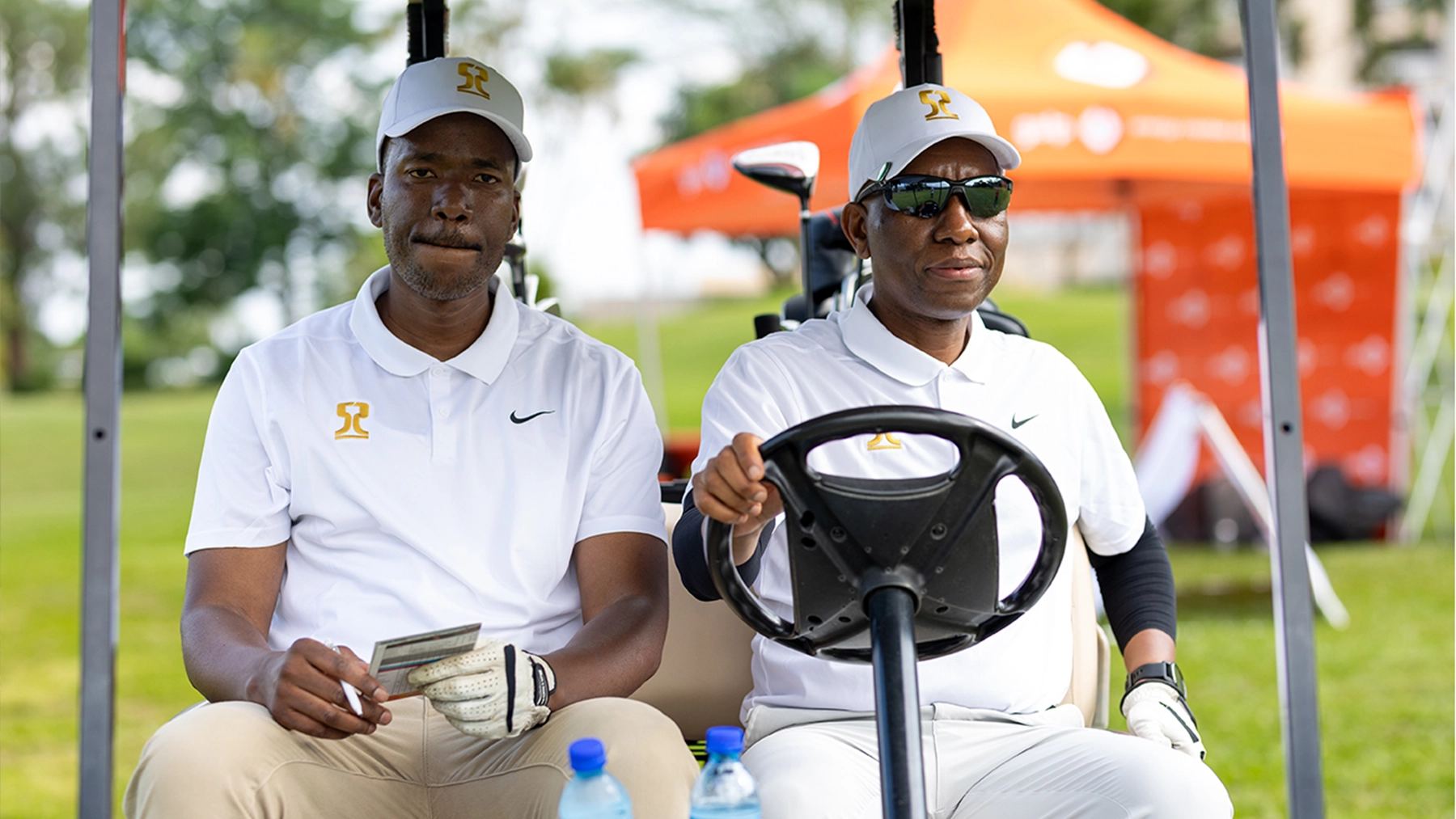 ESR Golf Day 2025 — Golfers together in a cart